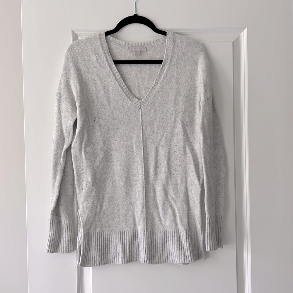 V-neck light gray sweater with split side